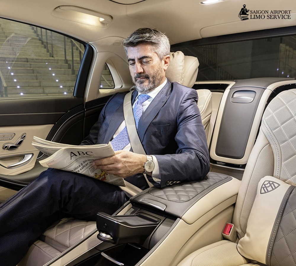 Saigon Airport Limo: Luxury Executive Transfers in HCMC Professional man relaxing in luxury Mercedes Benz for executive airport transfer by Saigon Airport Limo in Ho Chi Minh City.